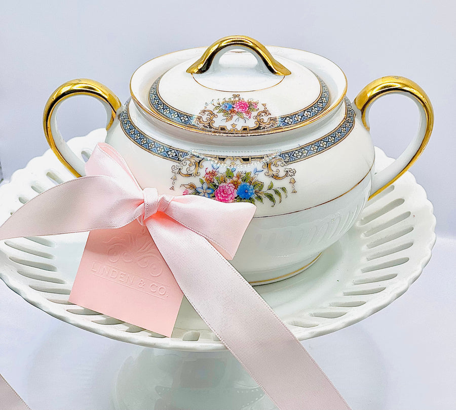 White sugar bowl with gold, pink and blue accents (Noritake)