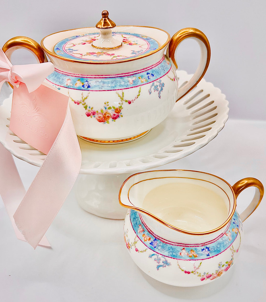 Aqua and gold dish and creamer set with pink accents